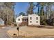 Charming home with manicured lawn, driveway, and covered front porch with stairs at 1775 Jody Ne Dr, Marietta, GA 30066