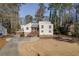 Charming two-story home with a spacious front yard and a welcoming front porch and driveway at 1775 Jody Ne Dr, Marietta, GA 30066