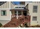 View of front door and porch with wood railings, steps, and seating area at 1775 Jody Ne Dr, Marietta, GA 30066
