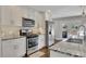 Modern kitchen featuring white cabinets, stainless steel appliances, and granite countertops at 1775 Jody Ne Dr, Marietta, GA 30066