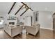 Bright living room featuring wood floors, barn door, fireplace, and comfortable seating at 1775 Jody Ne Dr, Marietta, GA 30066