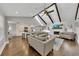 Open concept living room with high ceilings, exposed beams, and a fireplace at 1775 Jody Ne Dr, Marietta, GA 30066