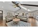 Spacious living room with wood floors and access to the dining and kitchen areas at 1775 Jody Ne Dr, Marietta, GA 30066