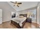 Vaulted ceiling main bedroom featuring a ceiling fan, hardwood floors, and closet at 1775 Jody Ne Dr, Marietta, GA 30066
