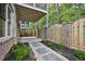Private backyard patio with brick fence and landscaping at 2179 William Way, Atlanta, GA 30345