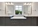 Modern bathroom with double sinks and a window offering a view at 2179 William Way, Atlanta, GA 30345