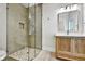Modern bathroom with glass shower and light wood vanity at 2179 William Way, Atlanta, GA 30345