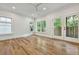 Hardwood floor bedroom with multiple windows and access to a deck at 2179 William Way, Atlanta, GA 30345