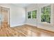 Spacious bedroom with hardwood floors and multiple windows at 2179 William Way, Atlanta, GA 30345