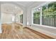 Hardwood floor bedroom with multiple windows and French doors at 2179 William Way, Atlanta, GA 30345