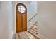 Light-filled entryway with hardwood floors and a beautiful wooden door at 2179 William Way, Atlanta, GA 30345