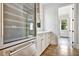White kitchen cabinets and stainless steel appliances with butlers pantry at 2179 William Way, Atlanta, GA 30345