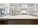 Large kitchen island with dark brown base and white quartz countertop at 2179 William Way, Atlanta, GA 30345