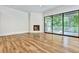 Spacious living area with hardwood floors, fireplace and access to a deck at 2179 William Way, Atlanta, GA 30345