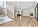 Open living room featuring hardwood floors and a fireplace at 2179 William Way, Atlanta, GA 30345