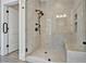 Spacious walk-in shower with a built-in seat and glass enclosure at 2179 William Way, Atlanta, GA 30345