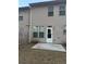 Home's backyard with patio and wooden fence at 3144 Spicy Cedar Ln, Lithonia, GA 30038