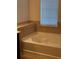 Bathroom features a soaking tub and tile surround at 3144 Spicy Cedar Ln, Lithonia, GA 30038