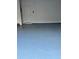 Garage with light-blue epoxy floor and a door to the house at 3144 Spicy Cedar Ln, Lithonia, GA 30038