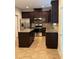 Modern kitchen features stainless steel appliances and an island at 3144 Spicy Cedar Ln, Lithonia, GA 30038