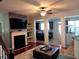Open living room with a fireplace and view into the kitchen at 3144 Spicy Cedar Ln, Lithonia, GA 30038