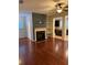 Living room boasts hardwood floors and a cozy fireplace at 3144 Spicy Cedar Ln, Lithonia, GA 30038