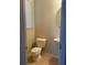 Simple powder room with a toilet, sink and a mirror at 3144 Spicy Cedar Ln, Lithonia, GA 30038
