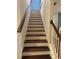 Elegant staircase with dark wood treads and white risers at 3144 Spicy Cedar Ln, Lithonia, GA 30038