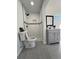 Bathroom with shower, toilet, gray vanity, potted plants, and tiled floors at 3422 Sweetwater Dr, Lawrenceville, GA 30044