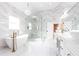 Luxurious bathroom with marble floors, soaking tub, and double vanity at 3000 Leeds Garden Ln, Alpharetta, GA 30022