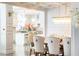 Open concept dining room with a view into the kitchen at 3000 Leeds Garden Ln, Alpharetta, GA 30022