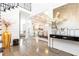Elegant entryway with hardwood floors, gold accents, and a view into the dining area at 3000 Leeds Garden Ln, Alpharetta, GA 30022