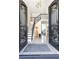 Bright and spacious entryway with a grand staircase and intricate metalwork at 3000 Leeds Garden Ln, Alpharetta, GA 30022