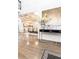 Entryway with hardwood floors, a console table, and a view of the dining room at 3000 Leeds Garden Ln, Alpharetta, GA 30022