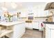 Modern kitchen boasting white cabinetry, a farmhouse sink, and high-end appliances at 3000 Leeds Garden Ln, Alpharetta, GA 30022