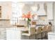 Gourmet kitchen with white shaker cabinets, quartz countertops, and a large island at 3000 Leeds Garden Ln, Alpharetta, GA 30022