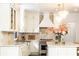 Elegant kitchen with white cabinets, marble countertops, and a spacious island at 3000 Leeds Garden Ln, Alpharetta, GA 30022