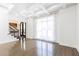Bright living room featuring hardwood floors and high ceilings at 3000 Leeds Garden Ln, Alpharetta, GA 30022