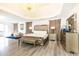 Luxurious main bedroom with king-size bed and chandelier at 3000 Leeds Garden Ln, Alpharetta, GA 30022