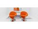 Modern office with orange chairs and a large desk at 3000 Leeds Garden Ln, Alpharetta, GA 30022