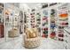 Large walk-in closet with ample shelving and drawers at 3000 Leeds Garden Ln, Alpharetta, GA 30022