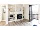 Bright sitting area with fireplace and built-in shelves at 3000 Leeds Garden Ln, Alpharetta, GA 30022