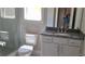 Bright bathroom with white cabinets, granite countertop and glass shower, offering a fresh and modern aesthetic at 4515 Aiden Way, Cumming, GA 30041
