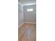 Walk-in closet with white shelving and hardwood floors offer a neat and organized space for storage at 4515 Aiden Way, Cumming, GA 30041