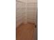 Organized closet with wood floor and white wire shelving for optimal storage and easy access at 4515 Aiden Way, Cumming, GA 30041
