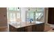 Open kitchen with center island, stainless steel appliances, and an open view to the great room at 4515 Aiden Way, Cumming, GA 30041