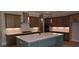 Stylish kitchen features stainless appliances, quartz counters, modern fixtures, and custom cabinets at 4515 Aiden Way, Cumming, GA 30041