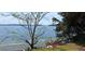 Scenic lake view framed by trees, with gentle waves and visible shoreline, emphasizing peaceful waterfront living at 4515 Aiden Way, Cumming, GA 30041