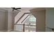 Bright living space featuring a high ceiling, exposed beams, and an open railing to the floor below at 4515 Aiden Way, Cumming, GA 30041