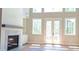 Bright living room with a cozy fireplace, white mantel, built-in shelves, and lots of natural light at 4515 Aiden Way, Cumming, GA 30041